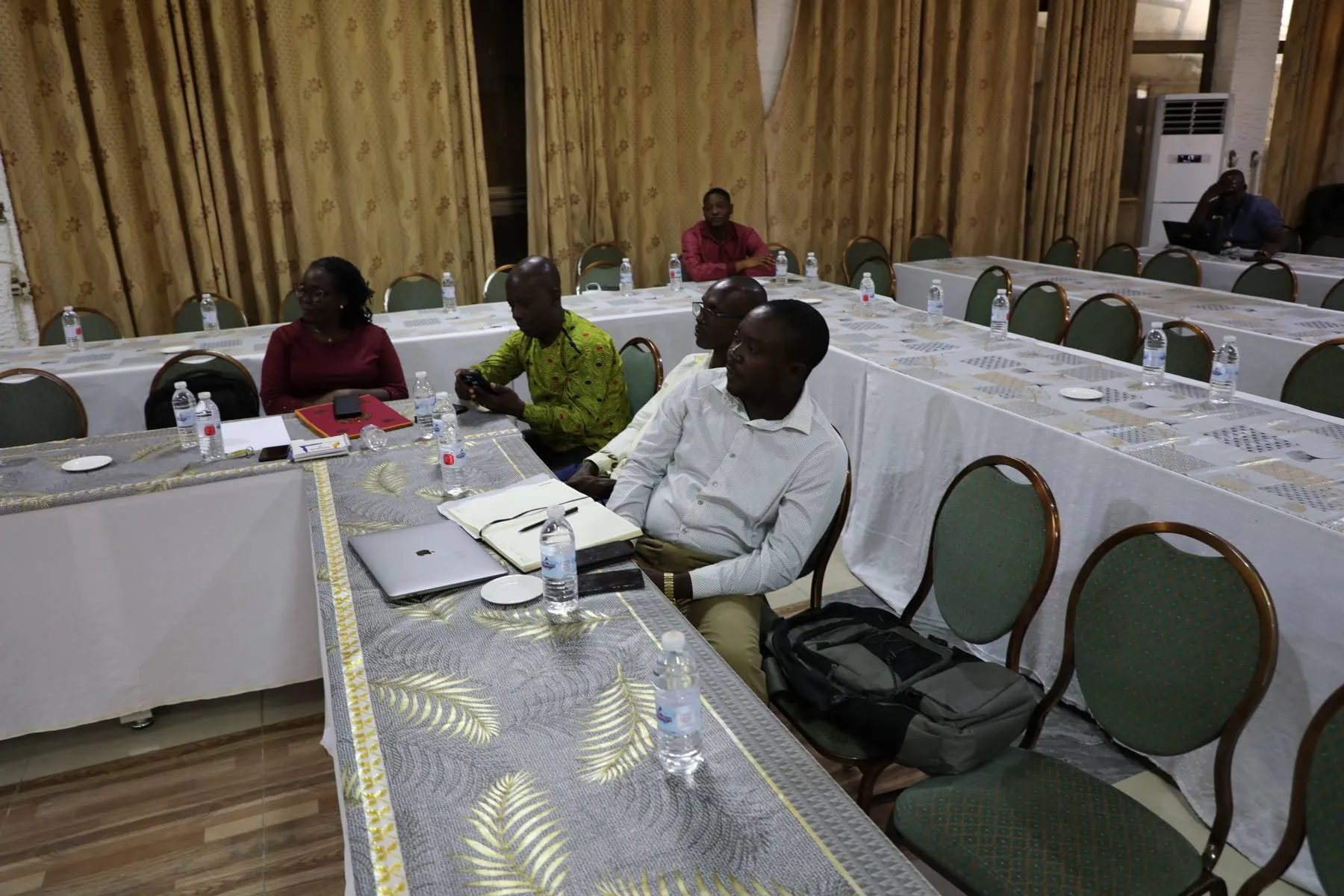 Participant taking notes during a CBT training session