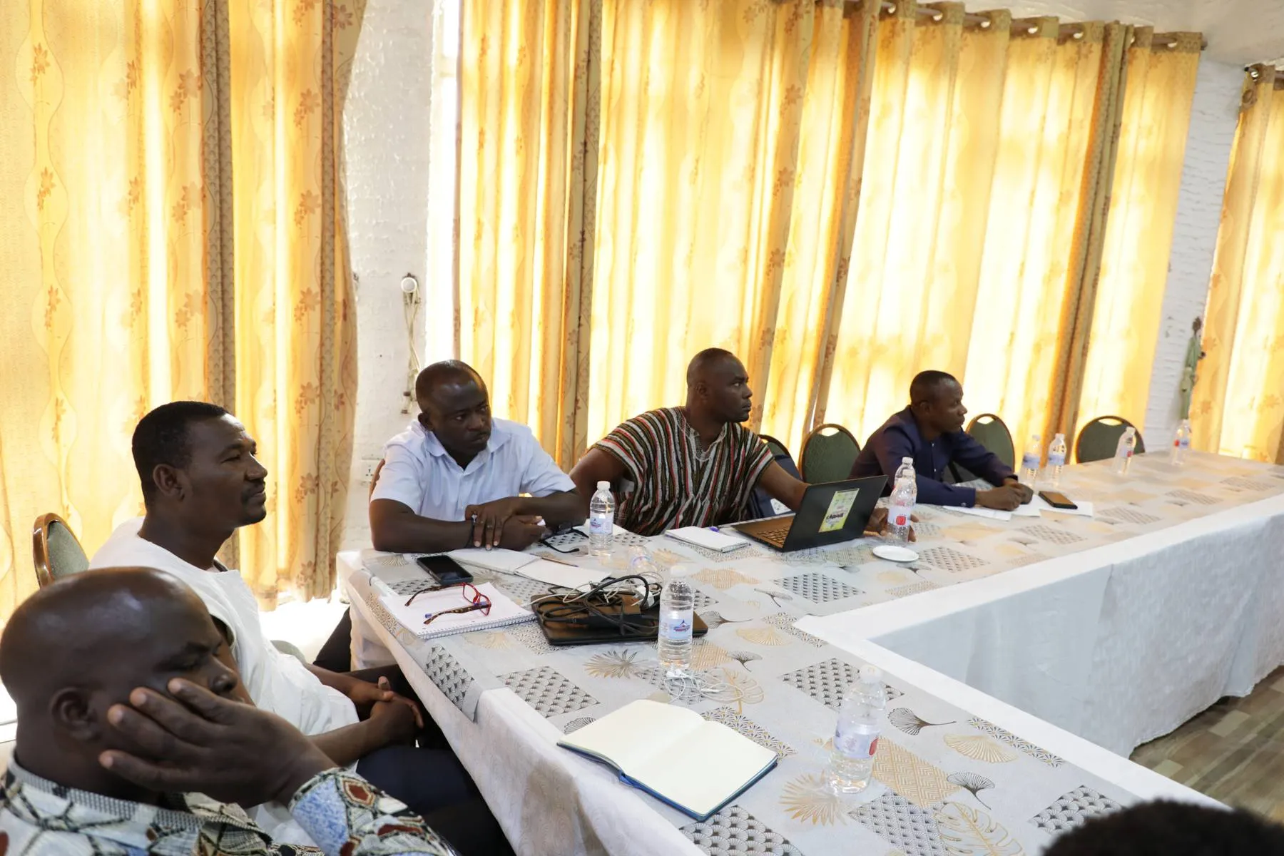 TVET participants in discussion around a workshop table