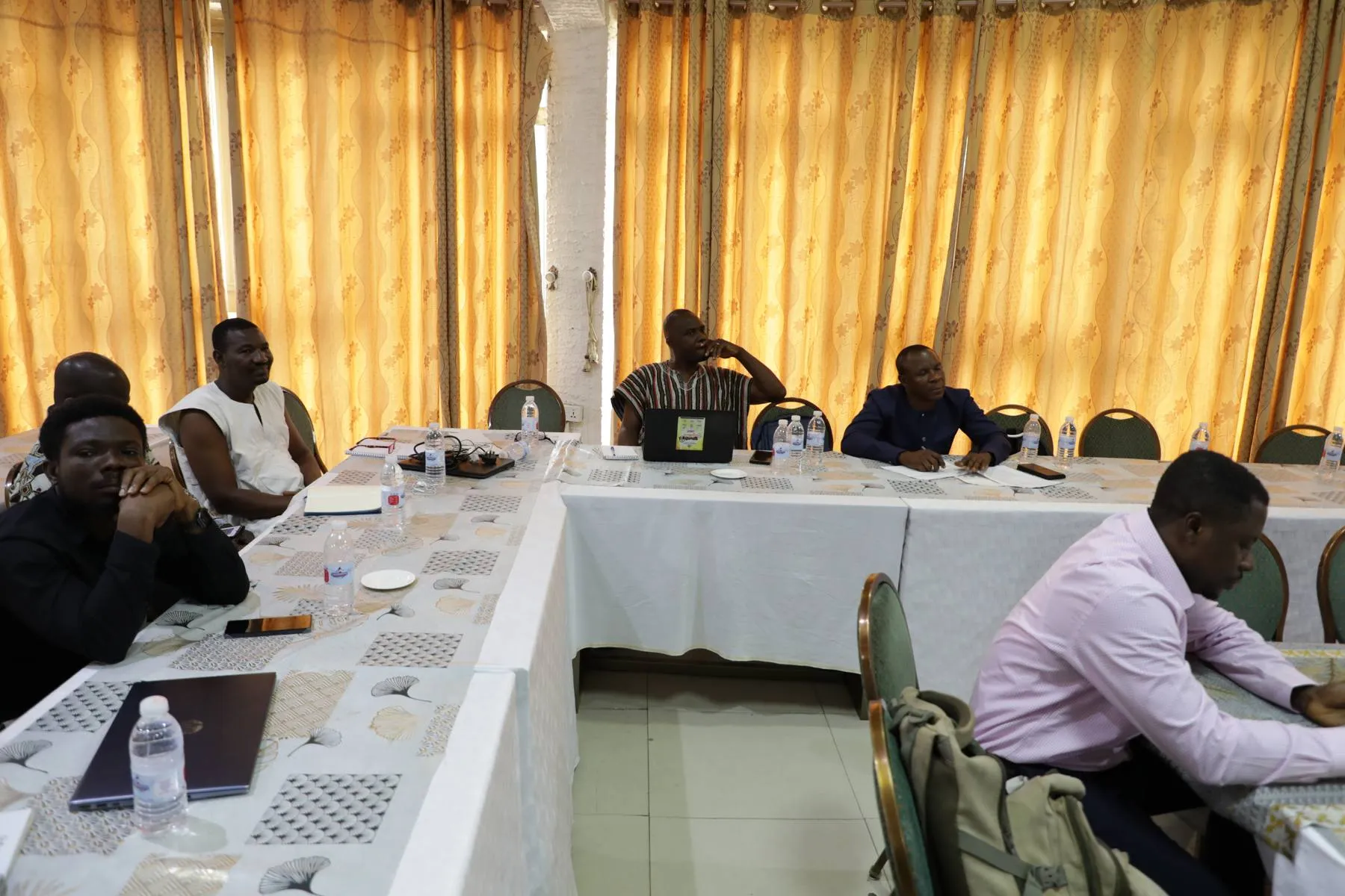 Participants seated at tables during a TVET training